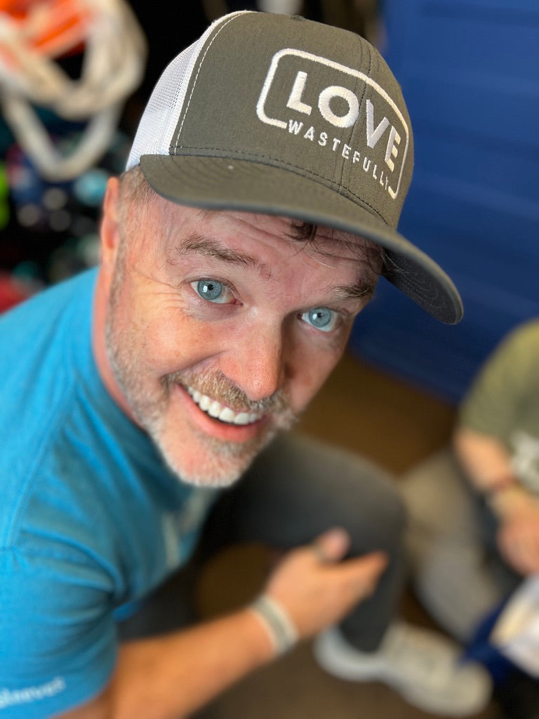 LOVE WASTEFULLY TRUCKER hat